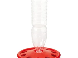 This is an image of a red plastic poultry feeder with a clear plastic bottle attached to it. The feeder has multiple openings around the base for birds to access the feed.
