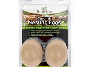 This is an image of a package containing two ceramic nesting eggs by Bainbridge. The packaging highlights that these eggs encourage egg production in nesting boxes, have a similar weight and consistency to real eggs, discourage egg breaking habits, and are useful for a simple broodiness test