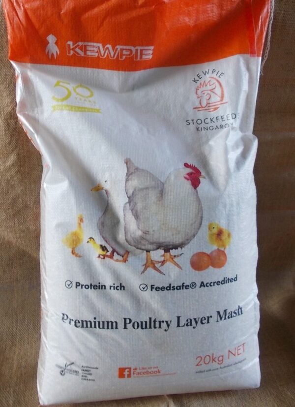 he image shows a bag of "Kewpie Premium Poultry Layer Mash." The bag is labeled as "Protein rich" and "Feedsafe® Accredited." It features images of chickens and chicks and indicates a weight of 20 kg net.