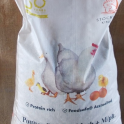The image shows a bag with illustrations of chickens and eggs. The text on the bag includes phrases like "Protein rich" and "Feedsafe Accredited."
